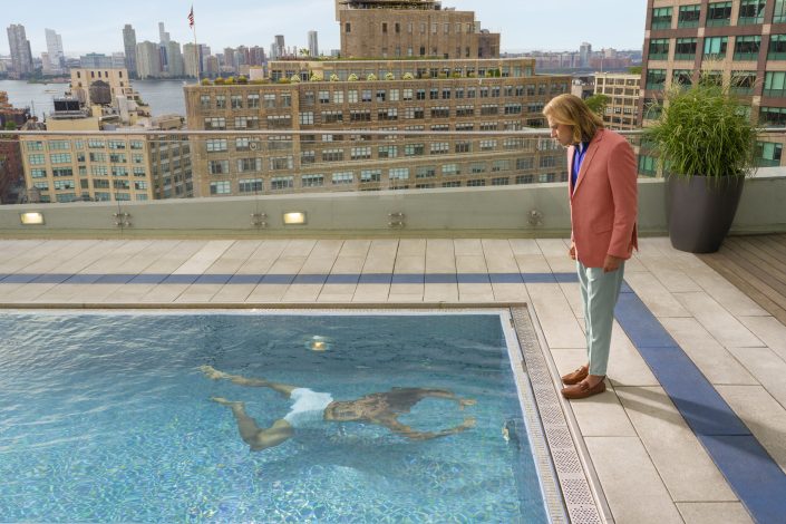 Jerry Metellus ad campaigns lifestyle photography. Modern Haus Soho Hotel New York. Portrait photography of pool with two figures painting.
