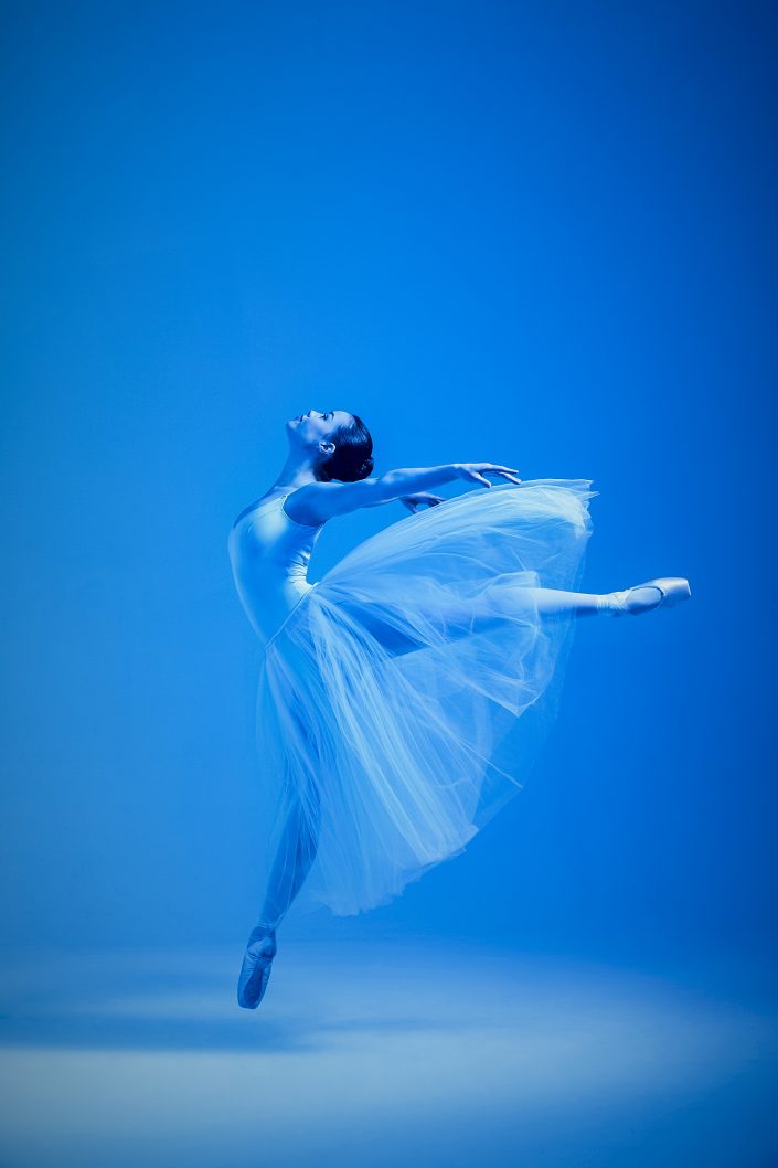 Jerry Metellus dance photography at JM Studios Las Vegas. Ballet photography with blue lighting of a ballet dancer performing an interpretive dance.