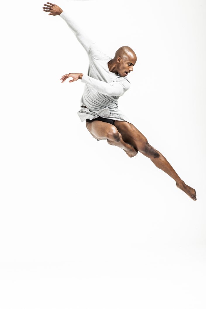 Jerry Metellus dance photography at JM Studios Las Vegas. Ballet photography of Alvin Ailey dancer Collin Heyward flying through the air.